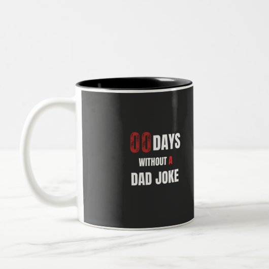 00 dagen zonder een grap van papa tweekleurige koffiemok (Links)