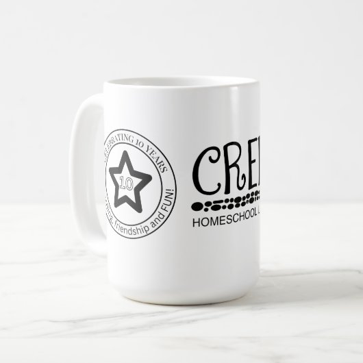 10 year logo  koffiemok (Voorkant links)