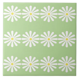 12 witte madeliefjes met gele centra op mintgroen tegeltje