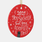 2022 is opgezogen maar heeft een rode foto van een keramisch ornament (Rechts)