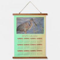 2025 Tapestry Calendar, een reiger die zich voedt 