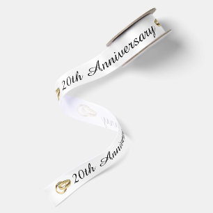 20-jarig jubileum met gouden trouwringen satijnen lint