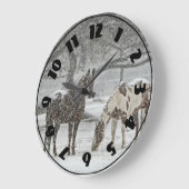 2 Paarden buiten in de winter tijdens het sneeuwwe Grote Klok (Hoek)