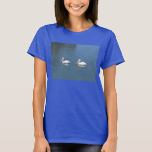 2 witte pelikanen op blauw t-shirt