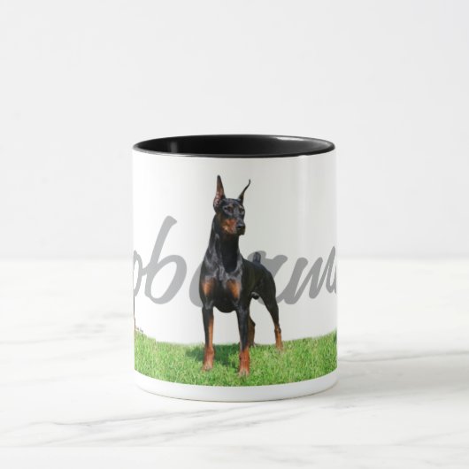 3 zwarte Doberman Pinschers met stamnaam Mok (Midden)
