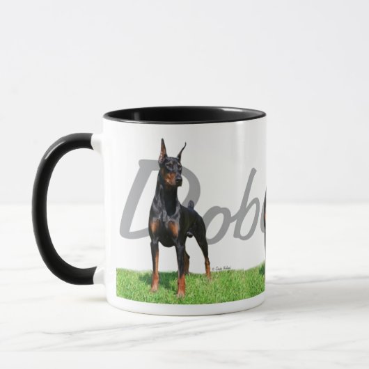 3 zwarte Doberman Pinschers met stamnaam Mok (Links)