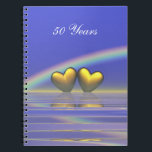 50e Jubileum Golden Hearts Notitieboek<br><div class="desc">Notitieboek met mijn afbeelding van gouden harten die op het water drijven onder een regenboog. In de  tekst staat "50 jaar".</div>