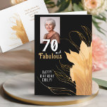 70 and Fabulous Gold Foliage 70th Birthday Foto Kaart<br><div class="desc">Elegante 70 en Fabulous Foliage 70e verjaardag fotokaart. 70 en prachtige tekst in trendy wit script met een naam en gouden gebladerte op een zwarte achtergrond. Personaliseer het met uw foto,  jouw naam en de leeftijd. Voeg jouw tekst toe aan de kaart of wis deze.</div>