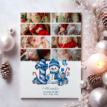 8 Foto Blue Snowman Eerste Kerstmis Feestdagenkaart<br><div class="desc">Vier het eerste vakantieseizoen van je kleintje met dit vrolijke winterontwerp met een blauw plaid nummer,  een schattige sneeuwpop en verspreide snoepstokken en geschenken. Pas het aan met de foto- en geboortegegevens van je baby om een aandenken te creëer dat charme en magie in je vakantieherinneringen brengt.</div>