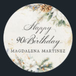 90e Verjaardag Party Witte Winter Bloemen Custom Ronde Sticker<br><div class="desc">Elegante winterwitte bloemen zijn genesteld in dennengroen en pinecones. De zachte ivoorwitte waterverf wasachtergrond is geaccentueerd met gouden vlekken om een verfijnde en chique esthetiek te creëer.</div>