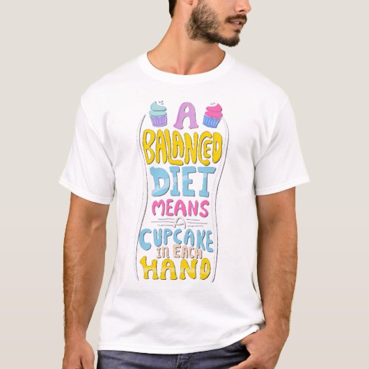 A balanced diet means a cupcake in each hand t-shirt (Voorkant)