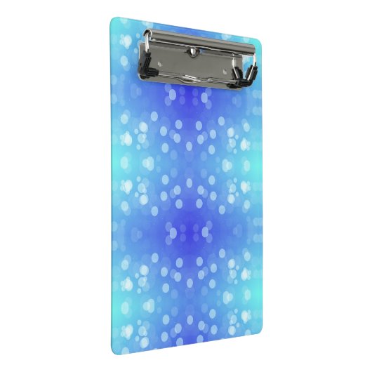 A clipboard featuring a blue and teal bokeh patter mini klembord (Schuin)
