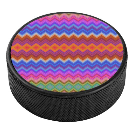 A colorful hockey puck features a vibrant zigzag  (3/4)