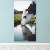 A cow drinks water in a natural stream canvas afdruk (Insitu (Houten vloer))