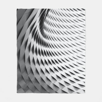 A curved facade covered in white latticework fleece deken