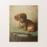 A Dachshund Puppy | Carl Reichert Legpuzzel<br><div class="desc">A Dachshund Puppy (1888) | Carl Reichert’s A Dachshund Puppy is a delightful portrait featuring a small brown dachshund puppy perched on a wooden stool. The artwork captures the puppy’s curious and innocent expression with exquisite detail, from the soft texture of its fur to the subtle shading of its surroundings....</div>