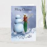 A Fairy Snowy Winter Feestdagen Kaart<br><div class="desc">Give someone special a smile with this fairy Christmas card. For this is more than just a fairy, dressed for the season, stumping about the snow, making a snowman, and making sure he's steady to stand on his own. No, there is more to a fairy life than one may think....</div>