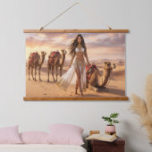 A Graceful Woman with Camels at Sunset Hangend Wandkleed (Slaapkamer)