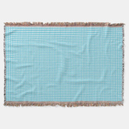 A light blue and white checkered blanket  deken