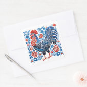 A metaphorical chicken image with a blue and white vierkante sticker (Envelop)