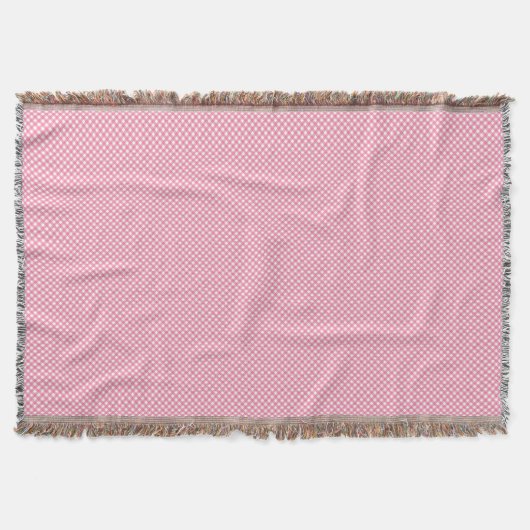 A pink woven blanket with a subtle pattern  deken (Voorkant)