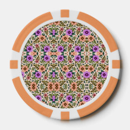 A poker chip with an intricate floral pattern 