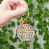 A round keychain with a floral pattern (Hand)