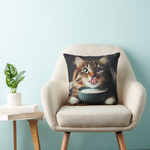 A tabby cat with sparkling eyes drinks delightfull kussen