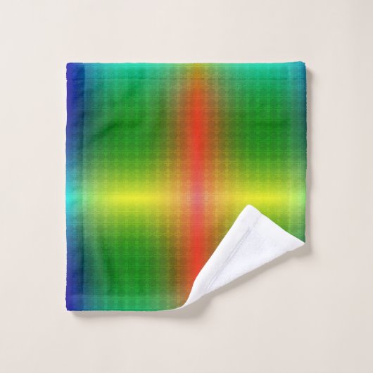 A towel set and washcloth display vibrant rainbow bad handdoek (Wasdoekje)