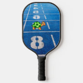 A turtle in a marathon race pickleball paddle (Voorkant)
