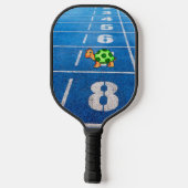 A turtle in a marathon race pickleball paddle (Achterkant)