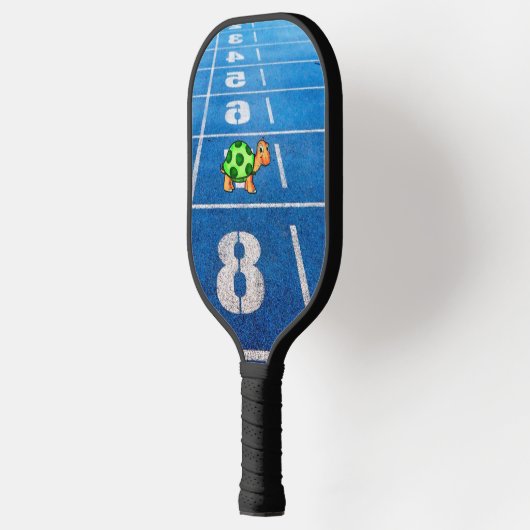 A turtle in a marathon race pickleball paddle (Links)