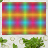 A vibrant, plaid-patterned fabric in rainbow color theedoek (Gevouwen)