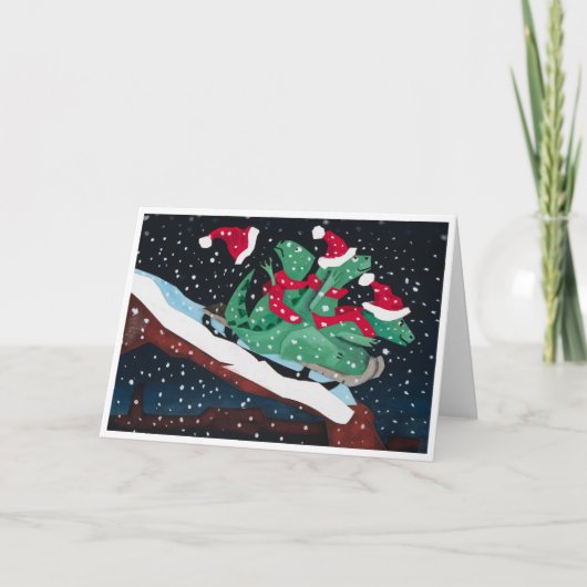A whimsical holiday card with sledding dinosaurs kaart (Voorkant)