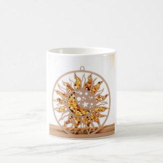 a white mug with an image of sun and moon koffiemok