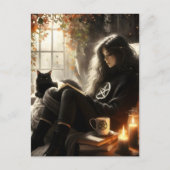 A witch reads with her black cat in a cozy chair briefkaart (Voorkant)