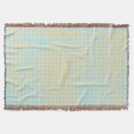 A woven blanket with a subtle green and beigহe  deken