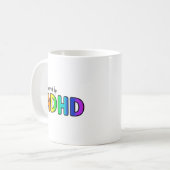 Aangedreven door ADHD | Regenboogtypografie Koffiemok (Voorkant links)