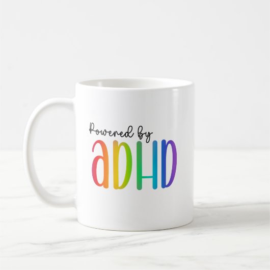 Aangedreven door ADHD | Regenboogtypografie Koffiemok (Links)
