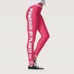 Aangedreven door planten minimaal Vegan roze Leggings<br><div class="desc">Deze roze leggings zijn voorzien van de woorden "Powered by planten" in het witte lettertype van alle petten,  versierd met kleine gestileerde bladeren en witte strepen op beide benen en op de wasband.</div>