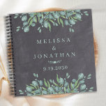 Aangepast Chalkboard Greenery Wedding Guestbook Notitieboek<br><div class="desc">Nodig gasten uit om goede wensen aan de pasgeborenen in dit aangepaste moderne maar rustige eucalyptustrouwgastenboek te verlaten. Dit grove trouwguestbook is voorzien van elegante botanische groene bladeren, en gepersonaliseerde bruid- en bruinnamen en datums. Bezoek ons eucalyptus bruiloft collectie voor huwelijksuitnodigingen, sla de datums op, en de perfecte huwelijksgunsten voor...</div>