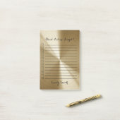 Aangepast goud metallisch dat is gelinkt om een li post-it® notes (Op bureau)