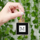 Aangepast monogram gedrukt. Zwart en Bleek grijs. Sleutelhanger (Hand)