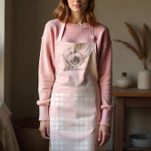 Aangepast roze keukengerei en broodbakken schort