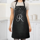 Aangepast zwart glitter Sparkle Monogram Schort<br><div class="desc">Pas dit trendy elegante schort eenvoudig aan met  zwarte mousserende glitter op een zwarte geborstelde metalen achtergrond.</div>