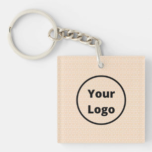 Aangepaste logo op kleine witte stippen op blush sleutelhanger