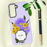 Aangepaste monogram Naam  wilde bloemen Samsung Galaxy Hoesje<br><div class="desc">Dit ontwerp is voorzien van paarse en gele wildflower foto's gemengd met digitale kunst groen. Het bevat sjablonen voor initiaal letter en naam in een wit uitgeknipt hoekblok. Personaliseer de tekst,  verwijder één tekstelement of bewerk met het ontwerpgereedschap om een lettertypestijl,  -grootte en -kleur te selecteren die u verkiest.</div>