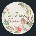 Aangepaste naam Merry Christmas Waterverf Vogelkra Ronde Sticker<br><div class="desc">Mooie waterverf ivoren textuur basis met een waterverf krans van greens,  twijgen,  diepe bessen,  en rode en witte poinsettias,  met een kostbare vliegende vriend gedrukt op de bloemstelen. Beide tekstgebieden zijn aanpasbaar. eerst zegt vrolijk kerstfeest,  verzenden bevat een script lettertype voor plaatsing van jouw namen</div>