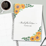 Aangepaste zonnebloem Eucalyptus 2023 Planner<br><div class="desc">Deze bloemplank is versierd met waterverf zonnebloemen en groene eucalyptusbladeren op een witte achtergrond. U kunt het personaliseren door jouw naam,  monogram,  en jaar toe te voegen. Omdat we ons eigen kunstwerk creëer,  zal je dit exacte afbeelding niet vinden van andere ontwerpers. Oorspronkelijke Waterverf © Michele Davies.</div>