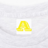 Aanpasbaar geel strijkijzer op letters labels (Aangebracht)